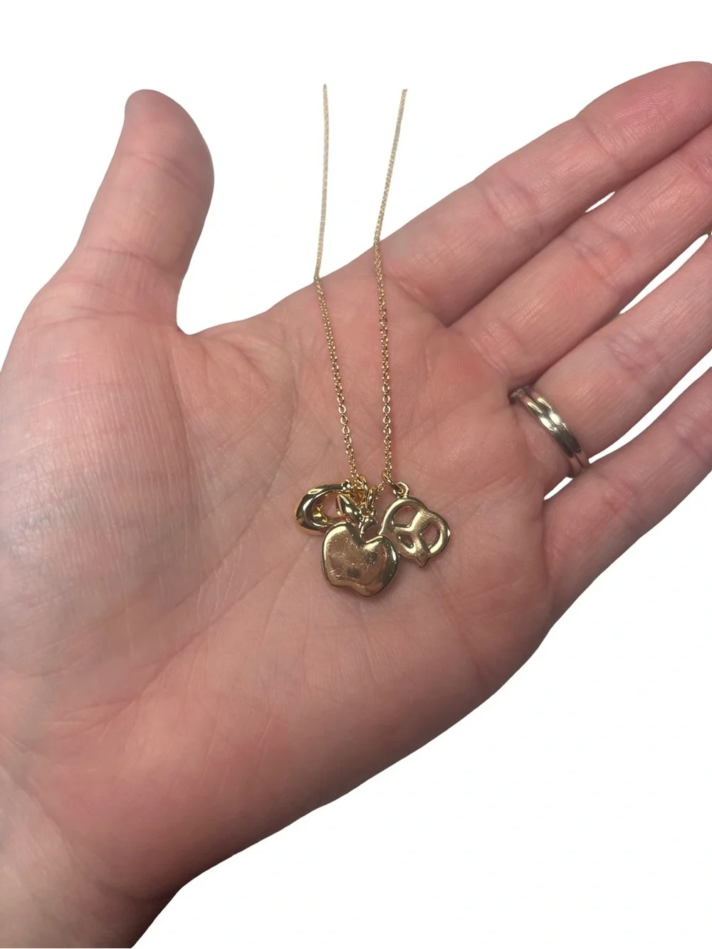 Coach Gold-Tone Charm Pendant Necklace with Red Apple and Pretzel Accents
